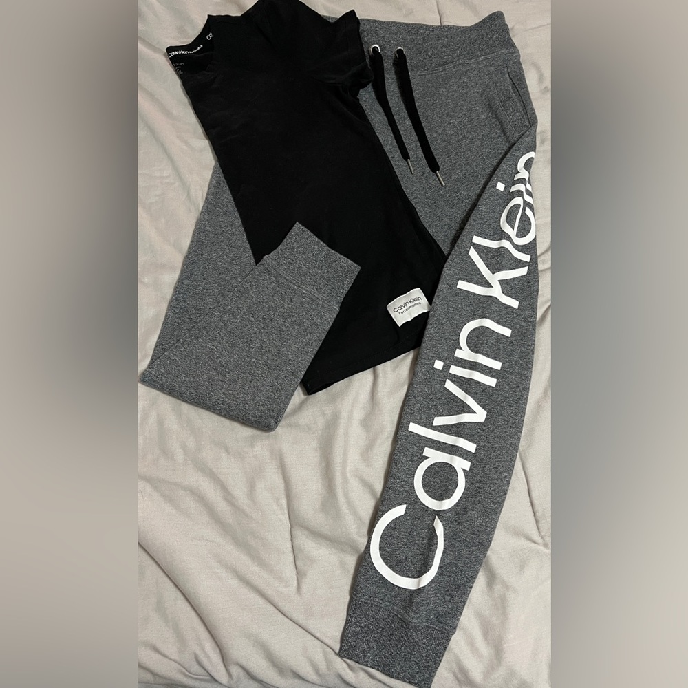 CALVIN KLINE OUTFIT size small black shirt gray pants.